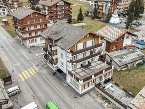 A multi-story hotel with balconies, a ski lift, and a mountain view. - Haus Astoria by Interhome (Saas-Grund)
