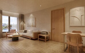 A modern living room with a sofa, coffee table, and a dining area with a chair. - VP Sisaked Hotel (Vientiane)