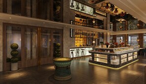 A multi-level hotel lobby with a bar area, seating, and decorative elements. - VP Sisaked Hotel (Vientiane)