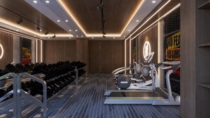 A gym with exercise equipment, including treadmills and dumbbells. - VP Sisaked Hotel (Vientiane)