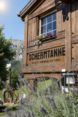 A wooden building with a sign that reads 'SCHERMTANNE' and the year '1903'. - Schermtanne Appartement/Fewo, Bad, WC, 1 Schlafraum Wohnung Nr 4 by Interhome (Adelboden)