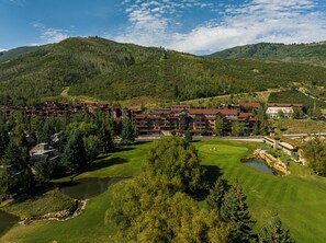 A resort with multiple buildings, a golf course, and a lake. - Ski-in/ski-out 3BR condo in Park City's Silver Star. (Park City)