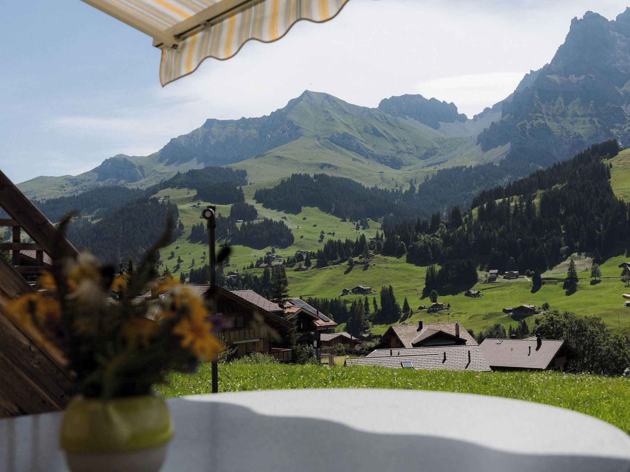 A mountain landscape with a village and houses in the valley.