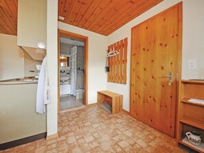 A compact kitchen with a sink and a towel hanging on the wall. - Chalet Bodenweg Appartement/Fewo, Bad, WC, 1 Schlafraum 1-Zimmerwohnung by Interhome (Frutigen)