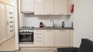 A compact kitchen with a Siemens oven, a coffee maker, a toaster, and a sink. - Haus Astoria by Interhome (Saas-Grund)