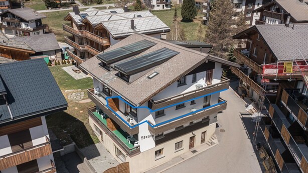 A multi-story building with a flat roof, solar panels, and balconies. - Haus Slalom by Interhome (Saas-Fee)