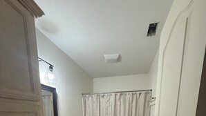 A bathroom with a sink, toilet, and shower curtain. - 2-bedroom apartment in welcoming Harlingen with AC comfort (Harlingen)