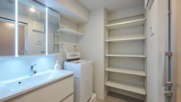 Apartment, Non Smoking (204, D-1) | Bathroom | Combined shower/tub, hair dryer, slippers, towels