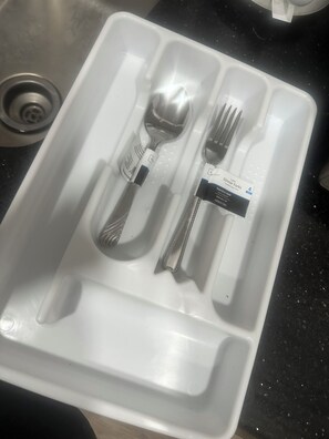 A white plastic tray with a fork, knife, and spoon, and a label indicating it is a set of dinnerware. - Fabulous Cozy Corporate Pvt luxury 1/1bth condo across UNLV,Strip!! (Las Vegas)
