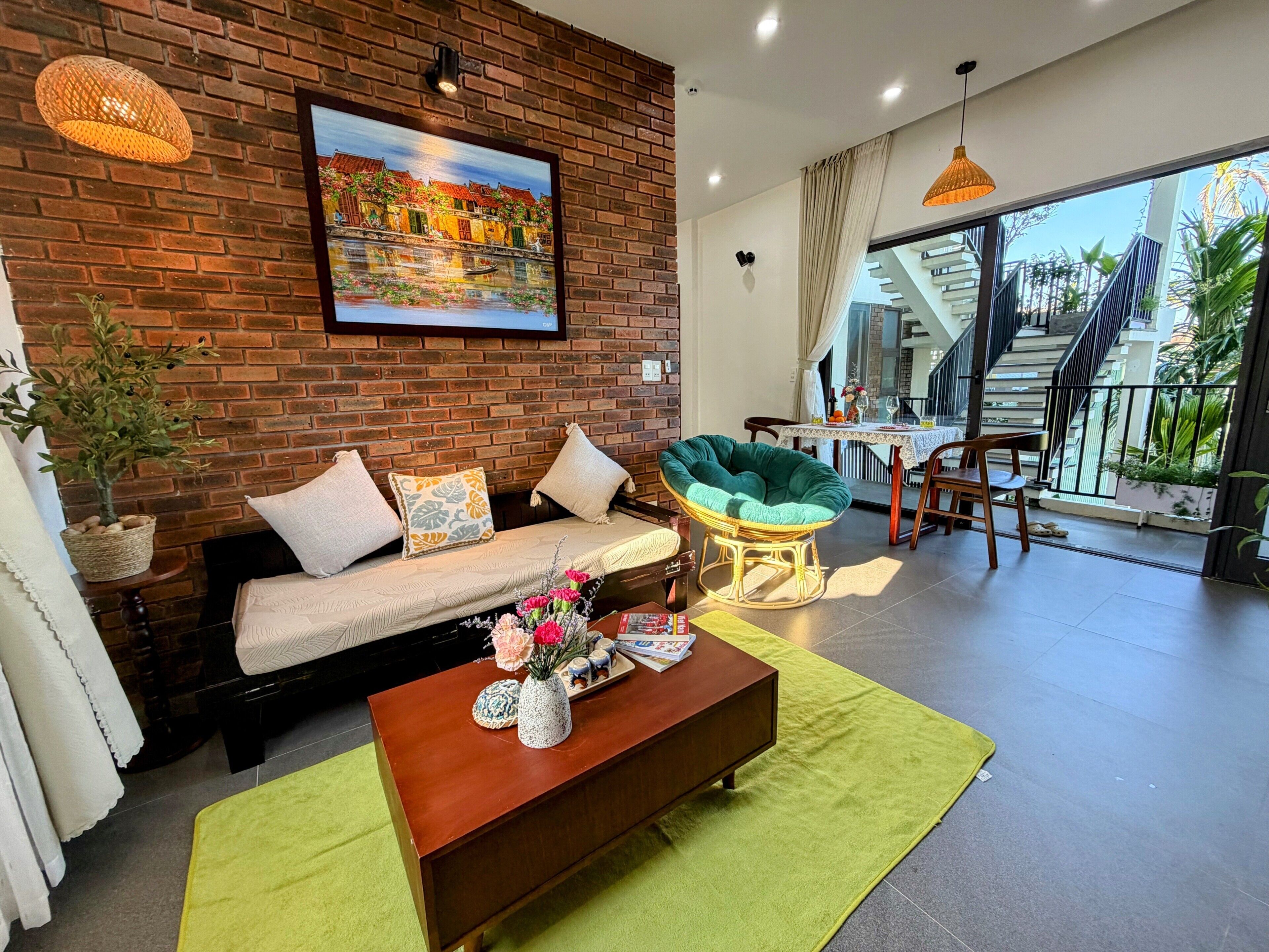 Family Apartment, Balcony, Garden View | Living area | 40-inch flat-screen TV with cable channels