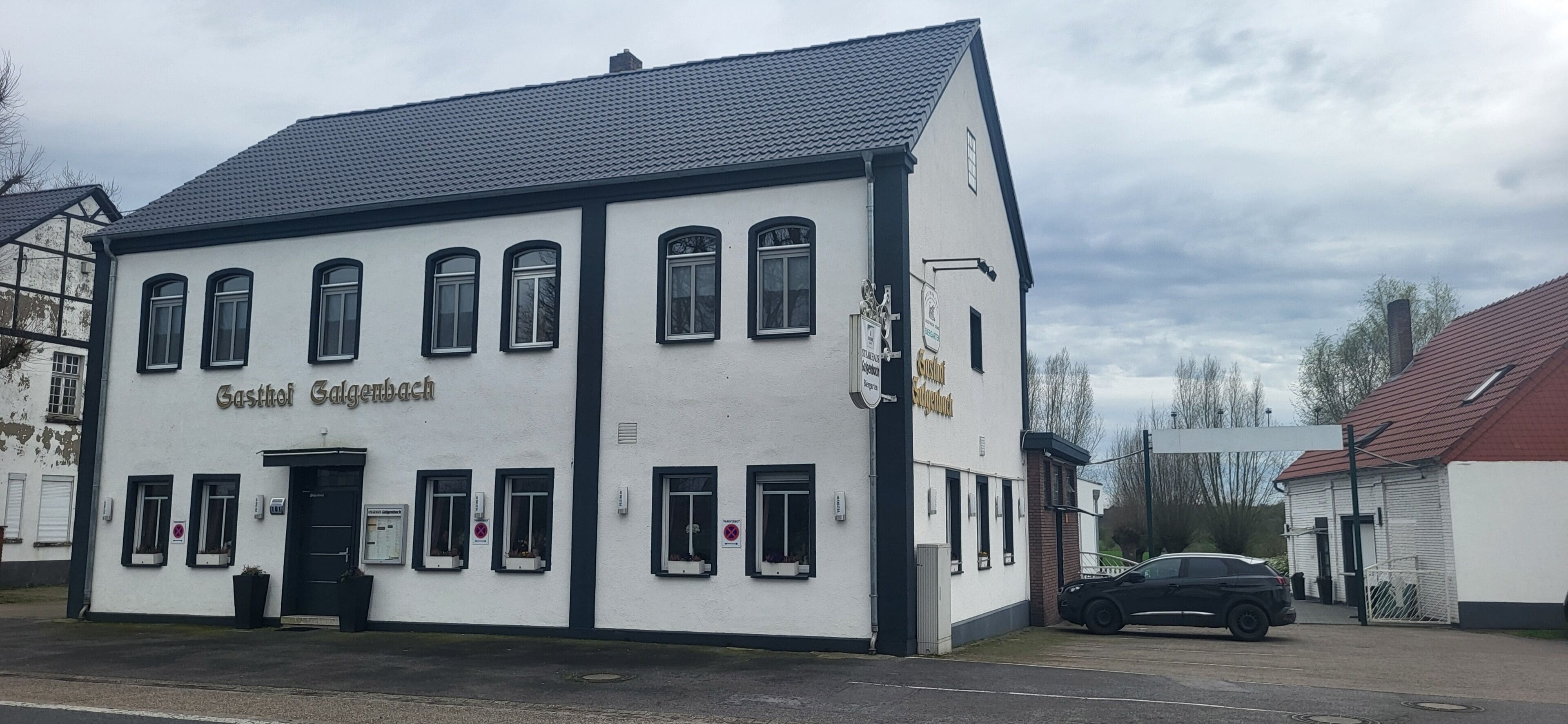 A two-story building with the name 'Gasthof Salgenbach' on the facade.