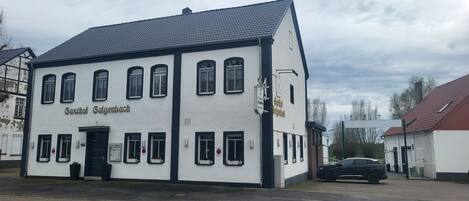 A two-story building with the name 'Gasthof Salgenbach' on the facade.
