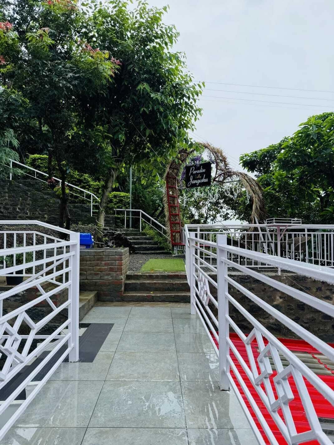 A staircase leading to a building entrance with a sign reading 'Paradise of the Jangoshus.'