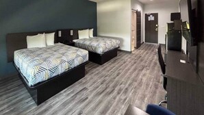 A hotel room with two beds, a desk, and a chair. - 2 Queen Beds|Non-Smoking,Kitchen (Dallas)