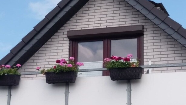 A building with a gabled roof and a window with a dark frame. - Apartment in Kappeln with swimming pool (Kappeln)