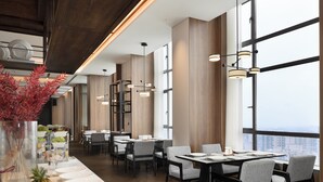 A modern restaurant with high ceilings, large windows, and contemporary lighting fixtures. - Days Inn by Wyndham Changsha Yuhua (Changsha)