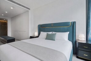 A modern hotel room with a large bed, bedside tables, a wardrobe, and a bathroom visible through an open door. - Australia 108 by Ready Set Stay (Southbank)