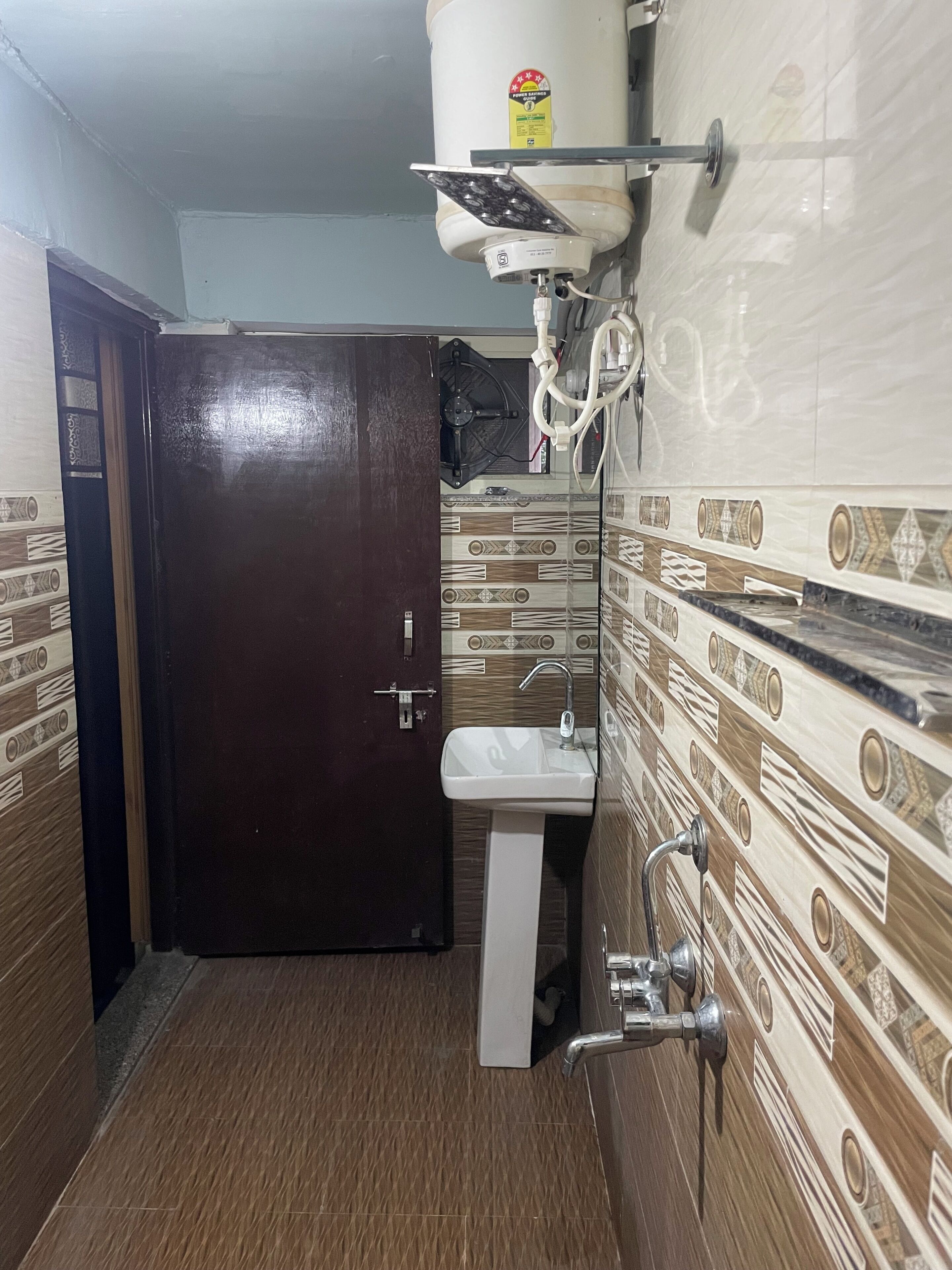 Shower, slippers, towels, toilet paper