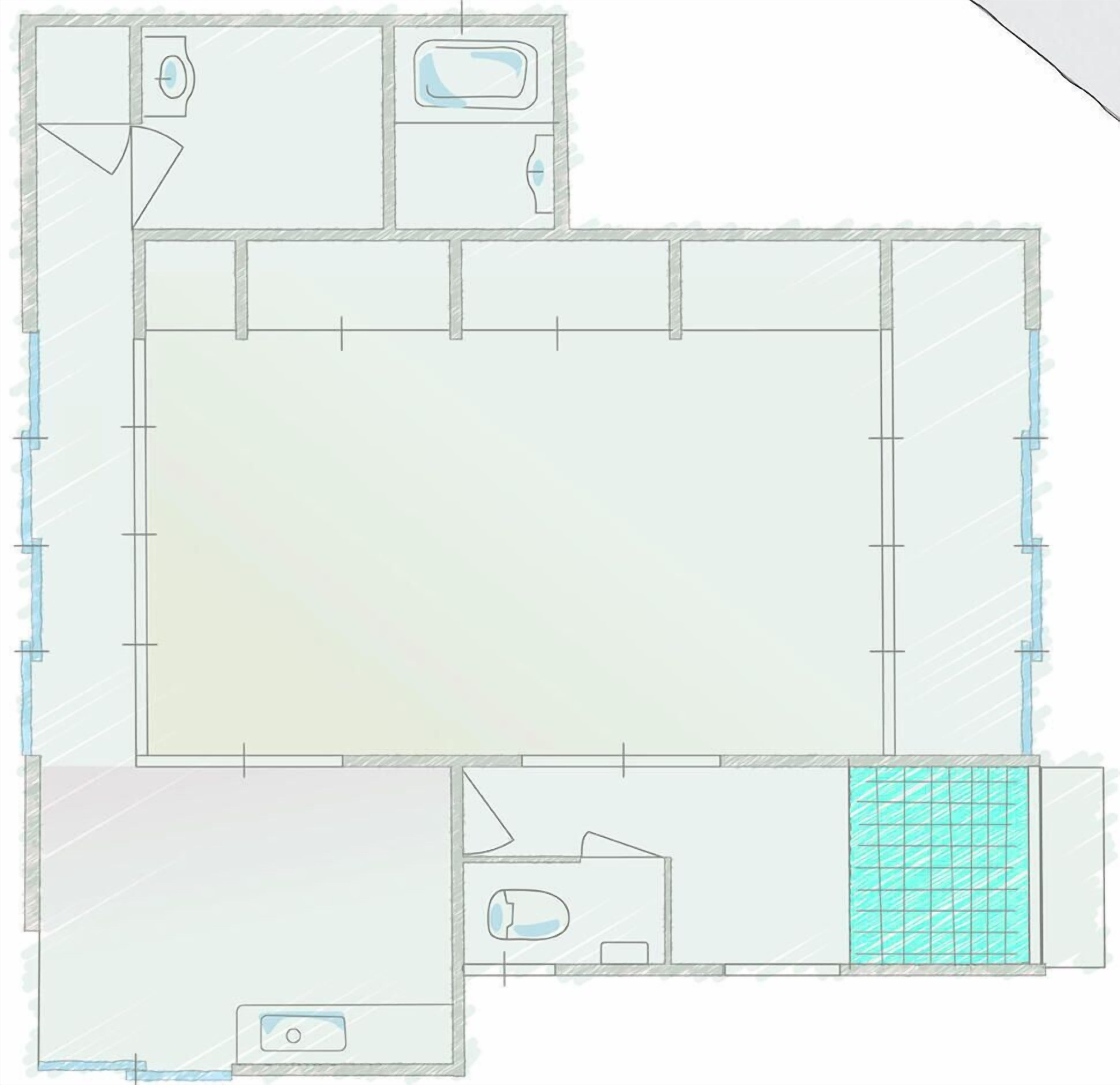 A floor plan with a large central area, a bathroom, and a kitchen.