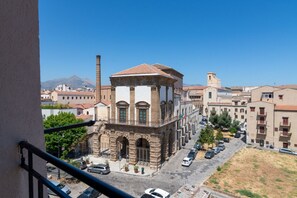 A building with a central tower, surrounded by other structures, with a clear view of the street below. - A welcoming and bright 85 square meters apartment, perfect for six people, located on the third floor of a period building with an elevator (NOT accessible to people with disabilities).The property enjoys an excellent location in Palermo (within the limi (Palermo)