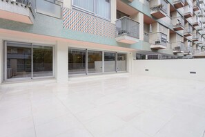 A multi-story residential building with balconies, large windows, and a tiled floor. - Allegro Boutique Apartment 1D by Liiiving (Porto)