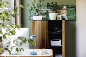 A workspace with a laptop, a desk lamp, and a printer on a wooden table. - LA GRIGLIA DI CASA NOSTRA SRL (Silvi)
