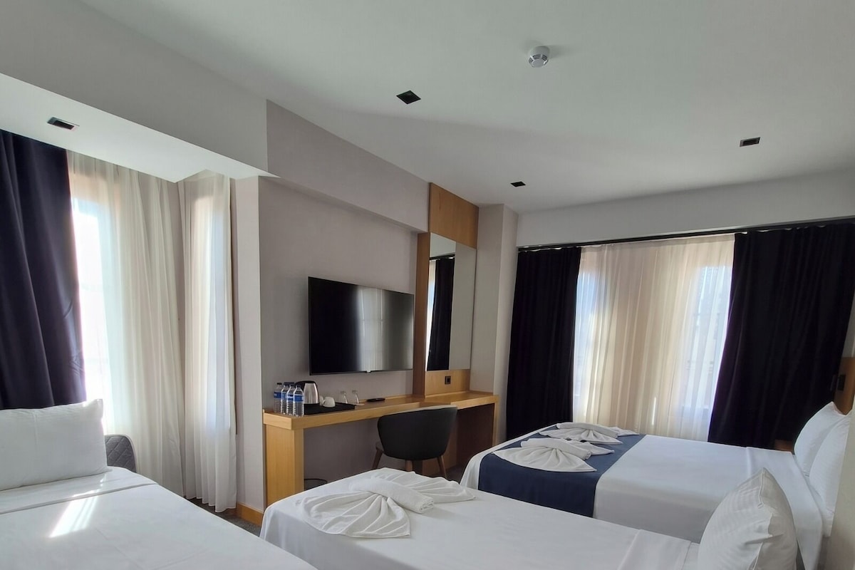 Family Quadruple Room, City View | Minibar, in-room safe, laptop workspace, free WiFi