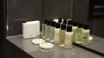A bathroom counter with toiletries and a soap dish.