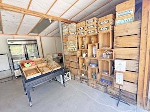 A storage area with wooden crates labeled 'Air Chief' and 'Three Bells.'