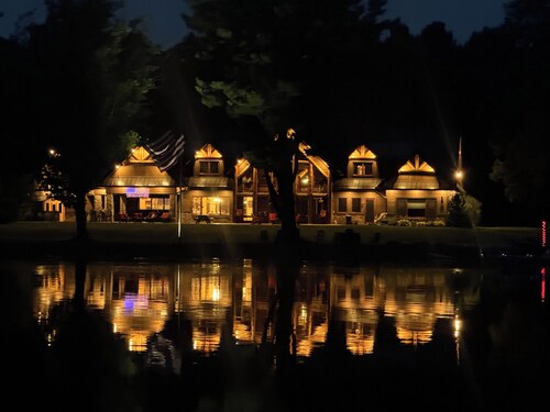 Spacious 5-bedroom lodge on Bone Lake with 2 guest cabins, pickleball and sauna.