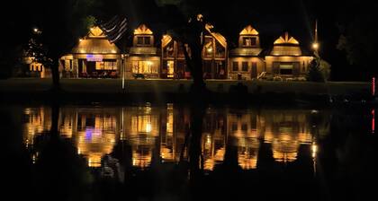 Spacious 5-bedroom lodge on Bone Lake with 2 guest cabins, pickleball and sauna.