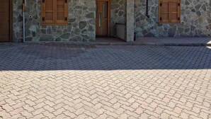 A two-story building with stone walls and wooden shutters on the windows. - House with garden and garage near the slopes (San Pietro)