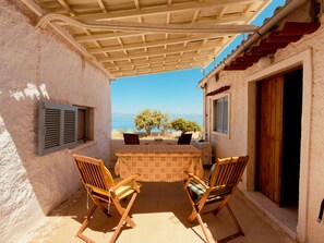 Outdoor dining - A stone retreat 40m from the sea, in a private 1,200m² estate on Aegina island. (Aegina)