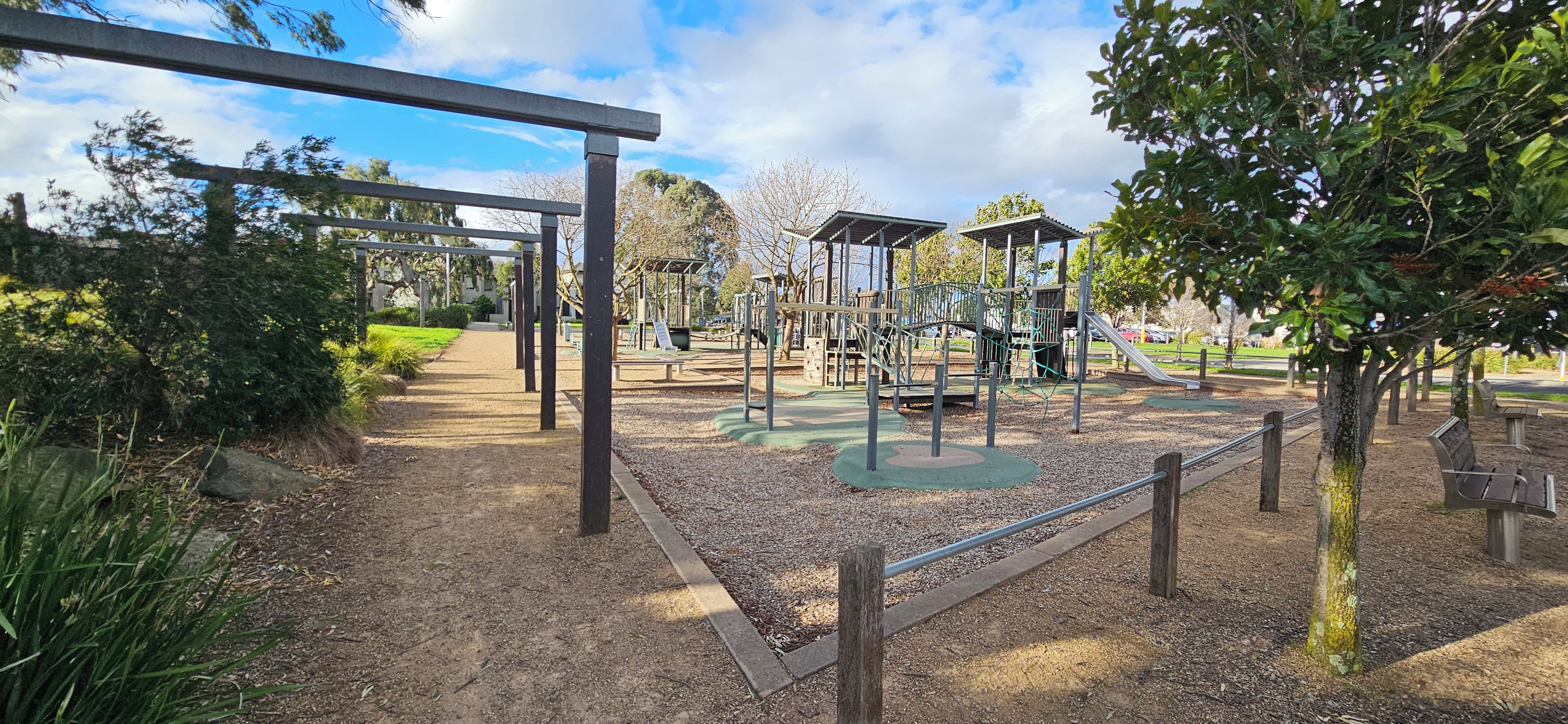 A playground with swings, slides, and climbing structures.