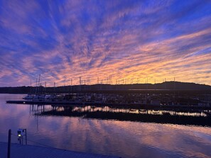 A marina with boats docked, calm water, and a sunset sky. - Ten Mile Tranquility! Our place is 1/2 mile from Marina with public boat dock. (Ten Mile)