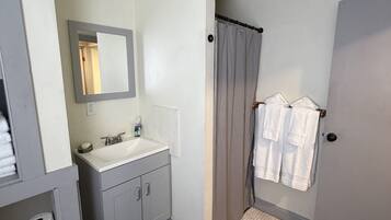 Shower, hair dryer, towels, soap
