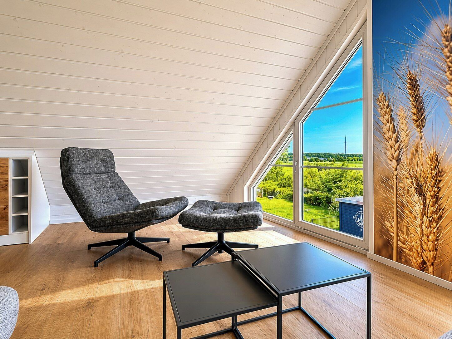 A modern interior with a high ceiling, a large window with a view of a green landscape, and a black table.