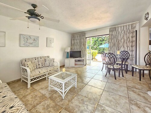 Poolside condo with garden access direct to beach!