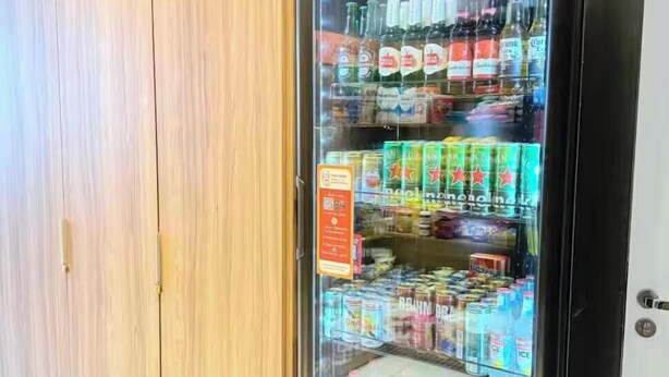 A beverage vending machine stocked with various drinks and snacks. - Themed Studio | Liberdade Metro Station (São Paulo)
