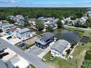 A residential area with houses, a river, and a dock. - Welcome to your Canal Front Oasis in South Bethany! (South Bethany)