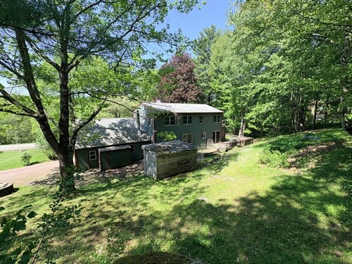 A 4BDR Family home in Essex Jct on a large wooded private lot w expansive deck and a treehouse!