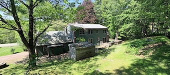 A 4BDR Family home in Essex Jct on a large wooded private lot w expansive deck and a treehouse!