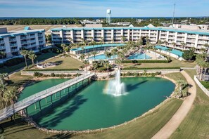 A resort with multiple buildings, a central pool, and a water fountain. - Beautifully decorated 2 bed/2 bath w/ Beach Set up at Amalfi in Miramar Beach. (Miramar Beach)
