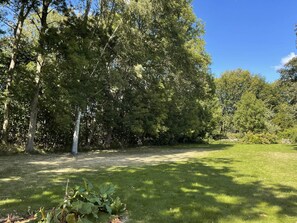 A grassy area with trees and a clear sky. - 6 Person Holiday Home in Gullbrandstorp (Haverdal)