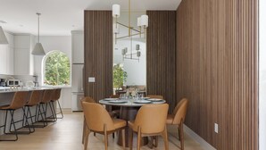 A modern kitchen with white cabinets, a dining area with a round table and chairs, and a large window with a view of greenery. - Tremendous 9-bedroom Luxury Compound - Two Pools & Two Houses (Austin)