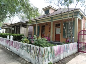 A house with a porch, a picket fence, and a mailbox. - Historic Double Shotgun Home in Spanish Town, Downtown Baton Rouge (Baton Rouge)
