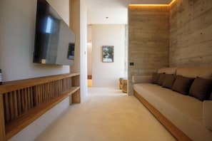 Suite superior, vistas a la playa | Zona de estar