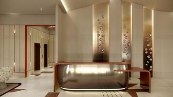 A modern reception area with a sleek reception desk, a wall-mounted decorative element, and a patterned floor.