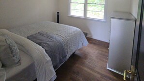 A bedroom with a bed, a window, and a radiator. - NewFound LakeHouse! 225' totally PRIVATE Sandy Beach! W-O-W!  (Bristol)