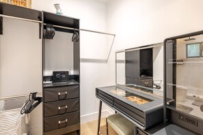 A compact bathroom with a mirror, a sink, and a storage unit with drawers. - 4BR Miaminear Design Districtbig Yard & Fire Pit (Miami)